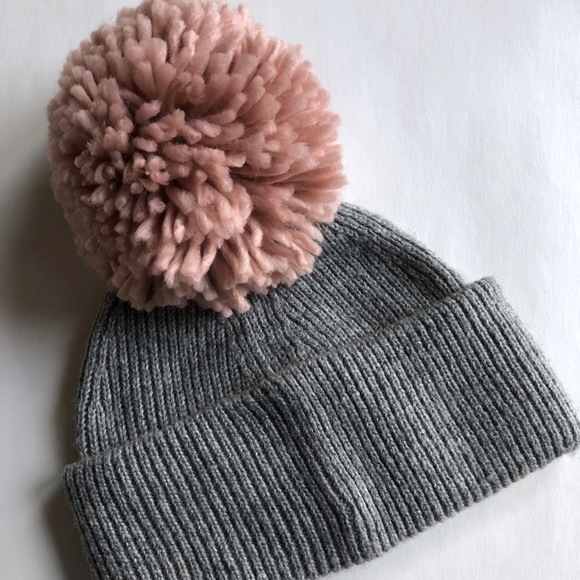 grey hat pink pom pom